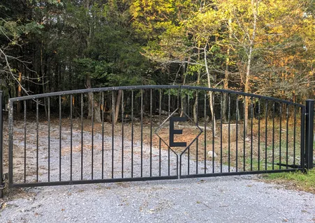 a view of backyard with swimming pool and outdoor seating
