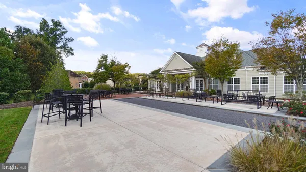a swimming pool with outdoor seating and yard