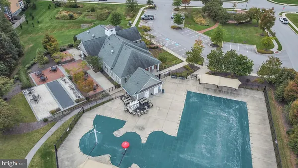 an aerial view of a house with outdoor space