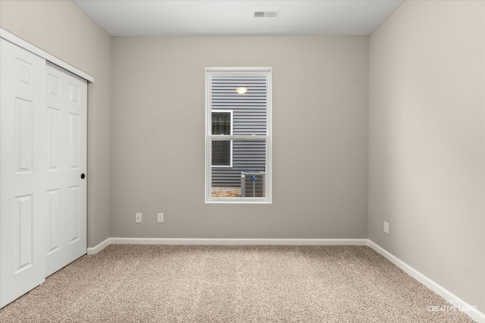 520 Preston Street Cortland, IL 60112 - Photo 5 of 16 a view of an empty room with a window