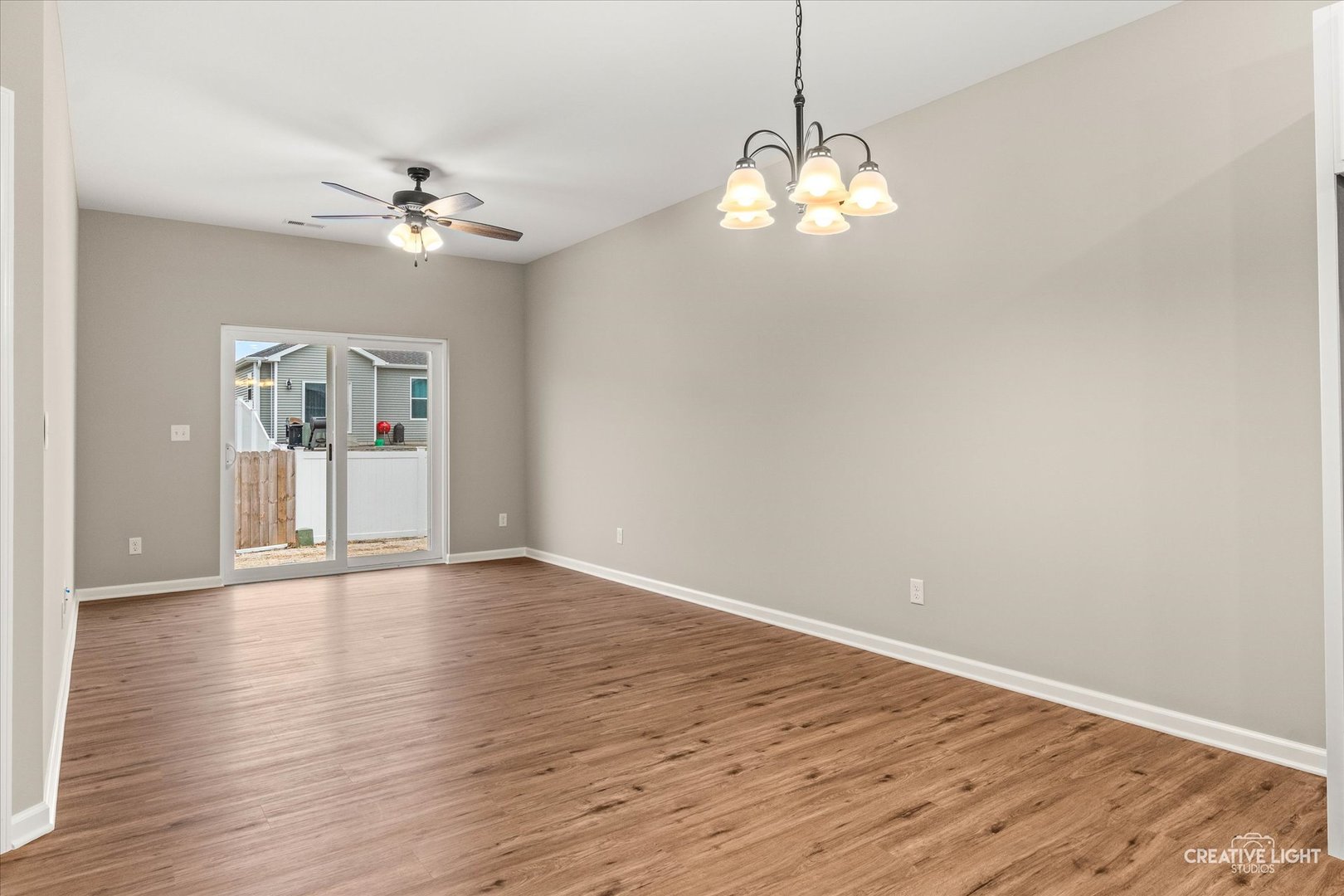 520 Preston Street Cortland, IL 60112 - Photo 9 of 16 a view of an empty room with wooden floor and a window