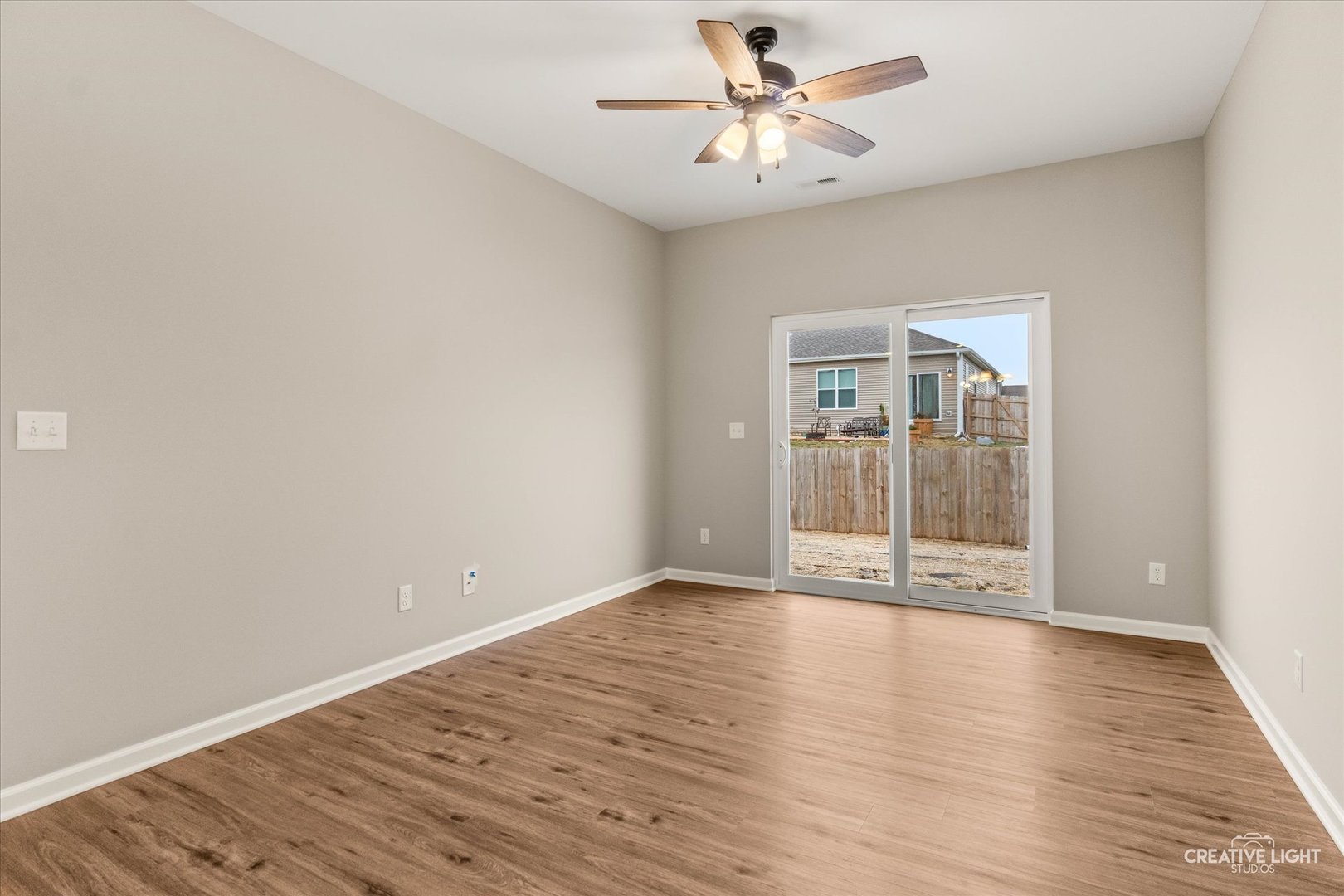 520 Preston Street Cortland, IL 60112 - Photo 10 of 16 wooden floor in an empty room with a window