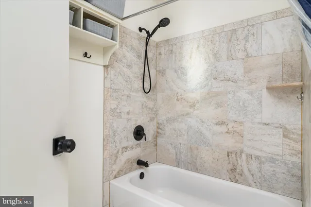a bathroom with a shower and a bathtub