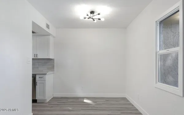 a living room with furniture and a ceiling fan