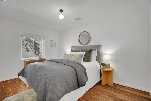 a bedroom with bed and window