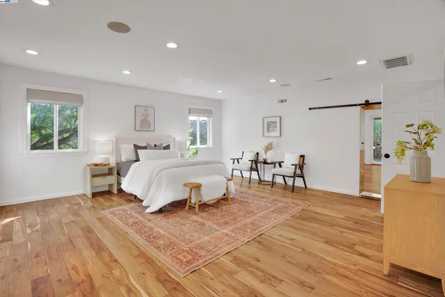 a bedroom with a bed and a table