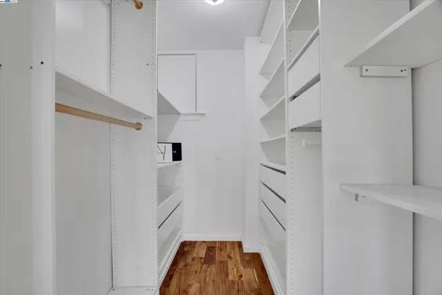 a view of entryway with stairs and wooden floor