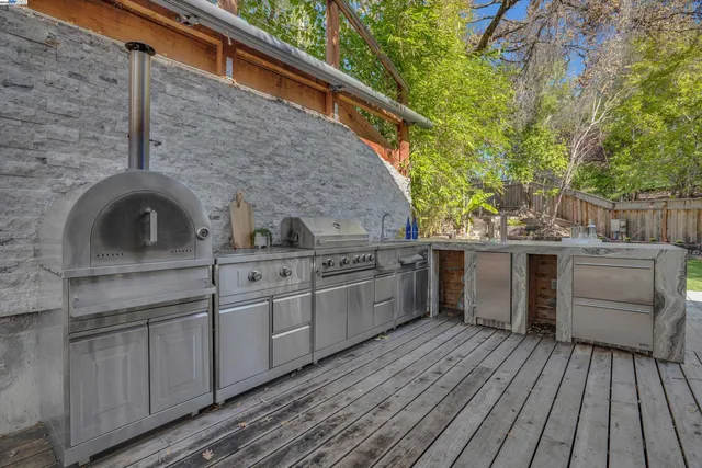 a kitchen with a sink and wooden floor