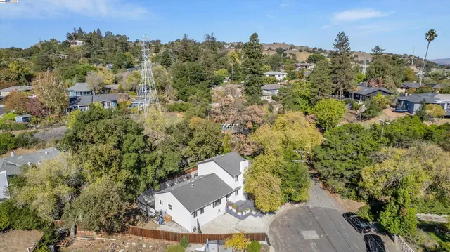 an aerial view of a house with outdoor space
