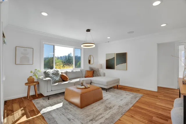a living room with furniture and large windows