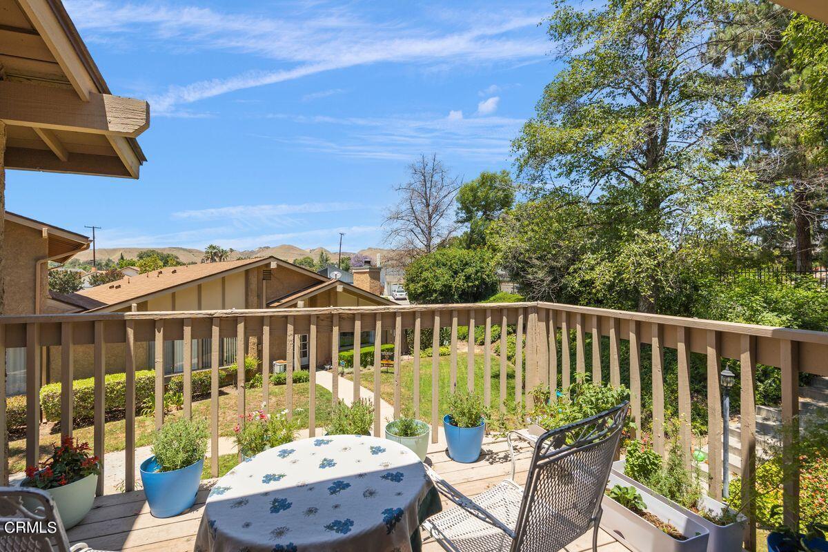 4448 Lubbock Drive, Unit D Simi Valley, CA 93063 - Photo 8 of 19 a view of a chair and table on the wooden floor