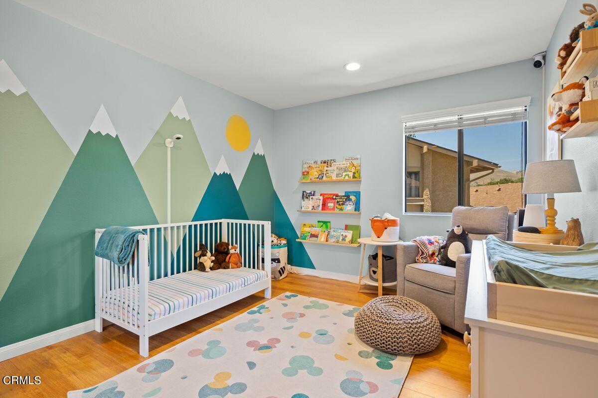 4448 Lubbock Drive, Unit D Simi Valley, CA 93063 - Photo 10 of 19 a bedroom with furniture and a wooden floor