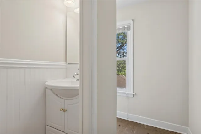 a bathroom with a sink and mirror