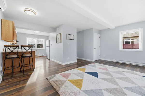 a view of a room with wooden floor and closet