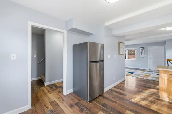 a kitchen with granite countertop a stove and a sink