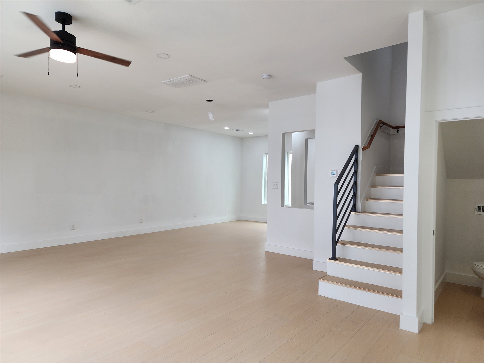 3411 St Emanuel Street Houston, TX 77004 - Photo 17 of 25 a view of an empty room with stairs