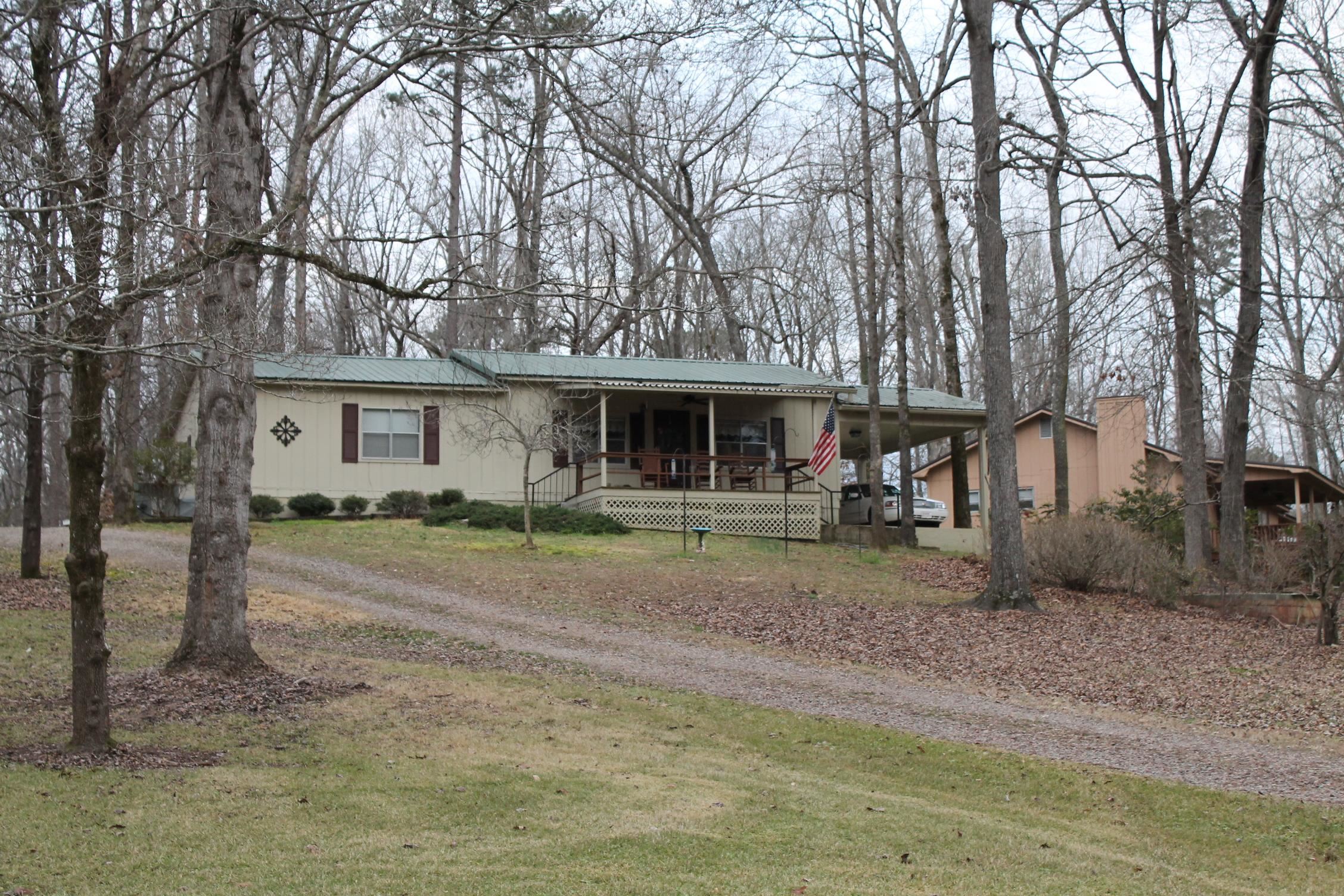 260 Bluebird Road Counce, TN 38326 - Photo 1 of 15 a front view of a house with a garden