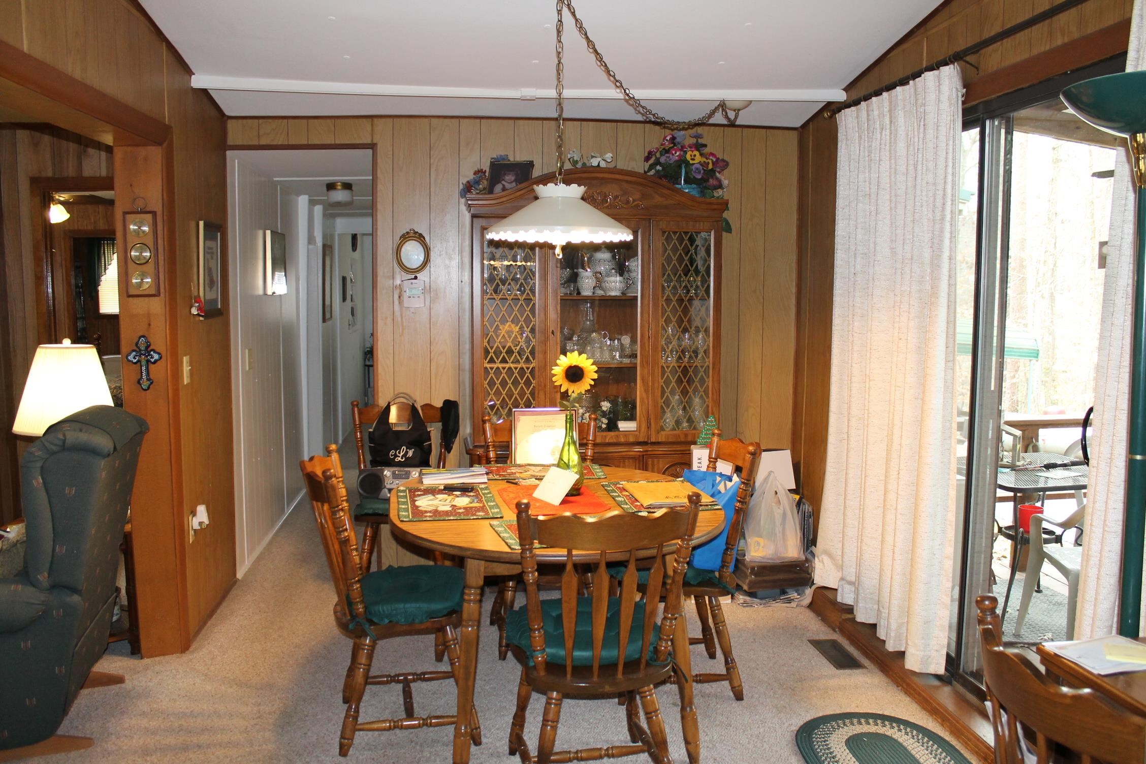 260 Bluebird Road Counce, TN 38326 - Photo 6 of 15 a dining room with furniture a chandelier and wooden floor