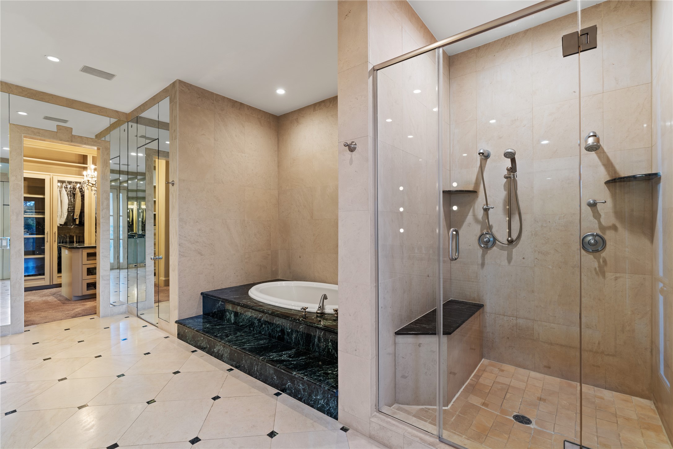 26 Crestwood Drive Houston, TX 77007 - Photo 18 of 24 Primary bathroom view of large shower, tub and water closet. Closet with chandelier at far end of photo.