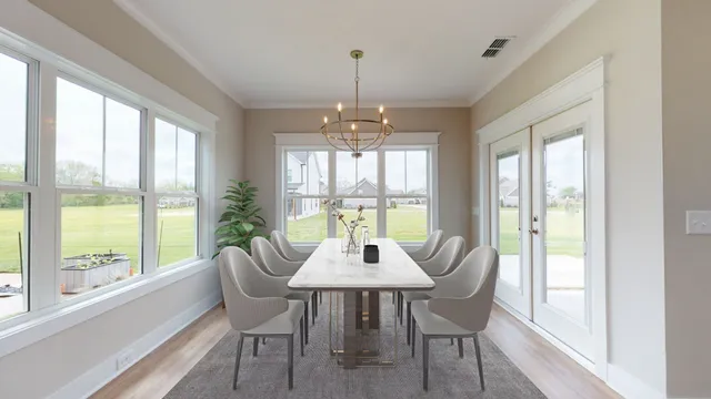 a dining room with wooden floor glass table and chairs