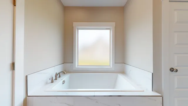 a bathroom with double vanity sink and a mirror
