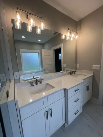 a bathroom with a sink and a mirror