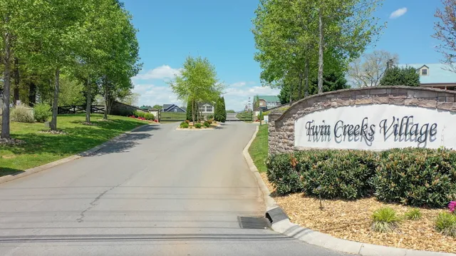 a view of a lake with trees in the background
