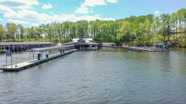 a view of a house with yard and sitting area