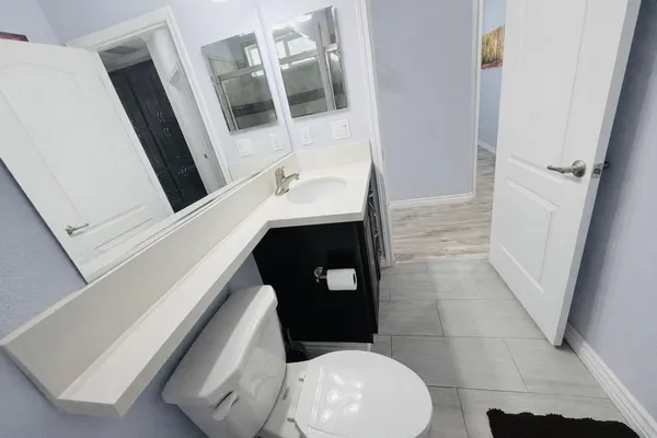 a bathroom with a toilet and a sink