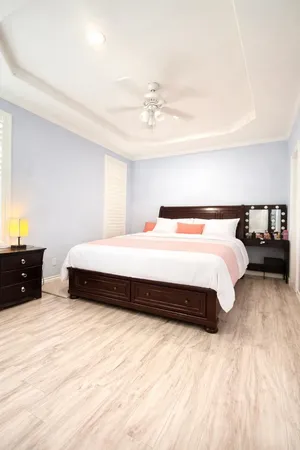 a bedroom with a bed and a dresser