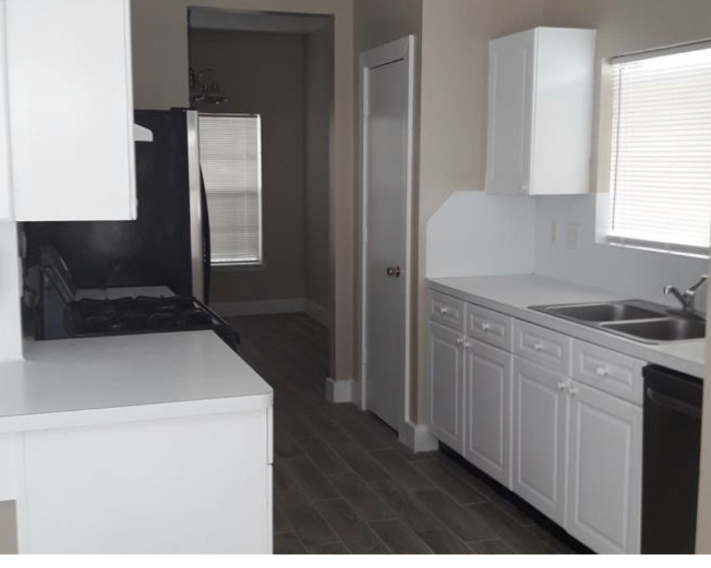 15902 South Alley Court Houston, TX 77082 - Photo 4 of 7 a kitchen with a sink cabinets and a window