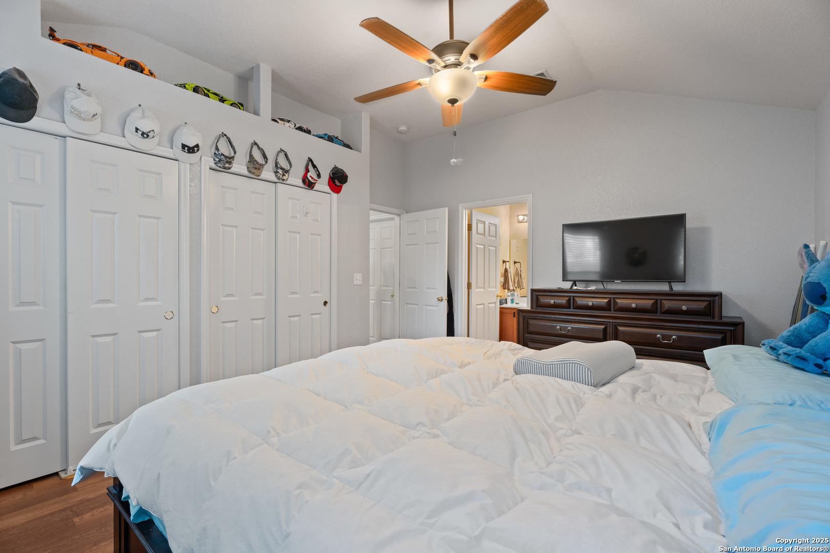 9419 Copper Mist Converse, TX 78109 - Photo 16 of 25 a bedroom with a bed and a flat screen tv