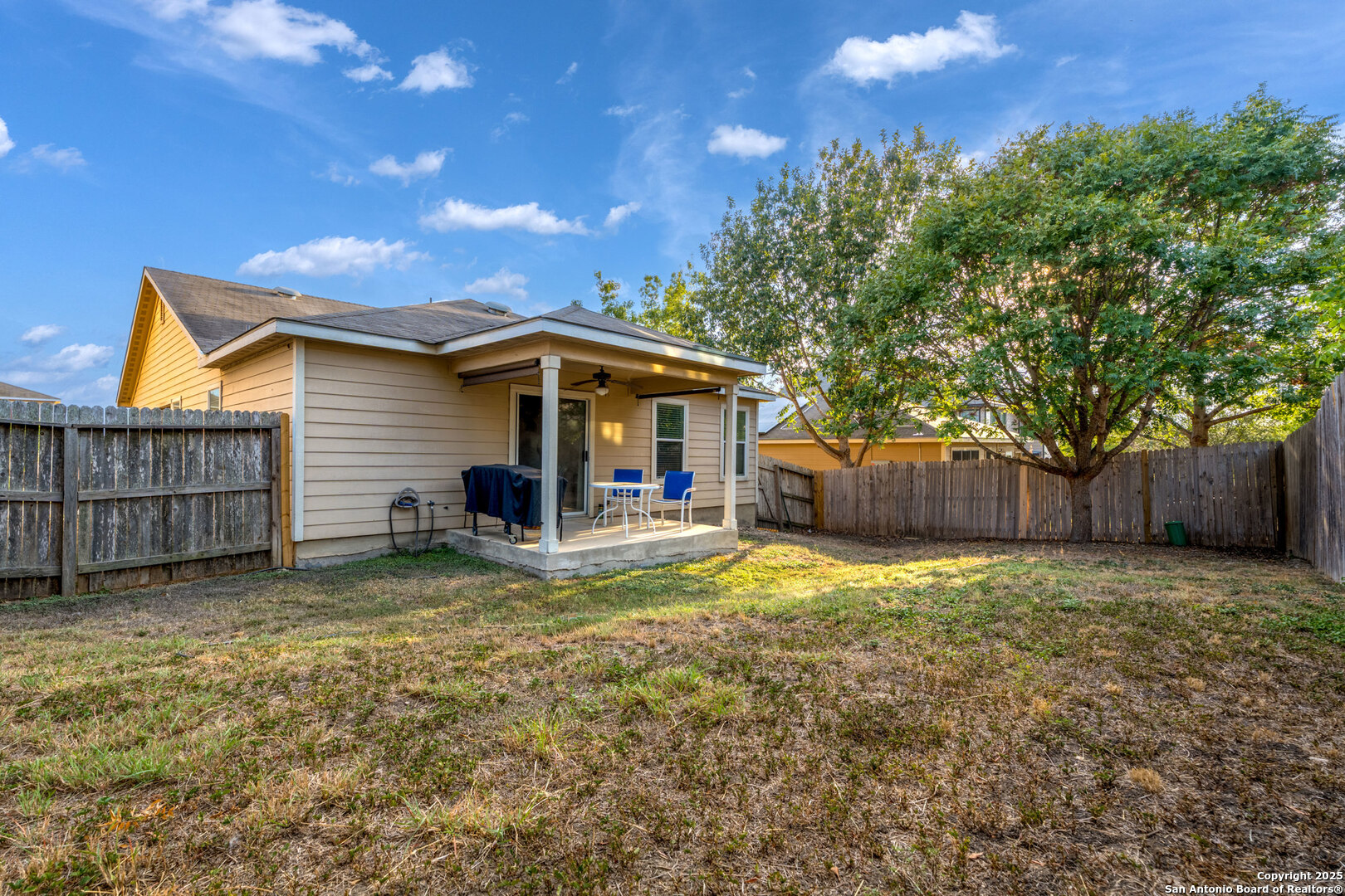 9419 Copper Mist Converse, TX 78109 - Photo 24 of 25 a view of a house with a yard and wooden fence