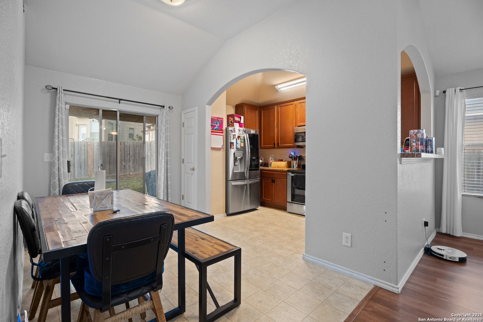 9419 Copper Mist Converse, TX 78109 - Photo 9 of 25 a view of a dining room with furniture and wooden floor