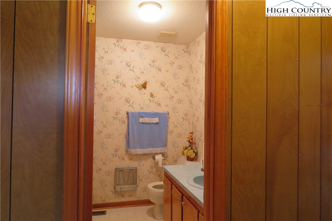 134 Carson Boulevard Sparta, NC 28675 - Photo 8 of 15 a bathroom with a sink and a mirror