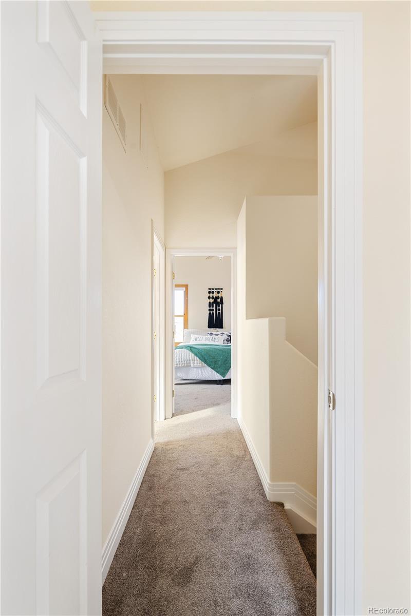 380 County Road Louisville, CO 80027 - Photo 20 of 42 a view of a hallway with white walls and a white door