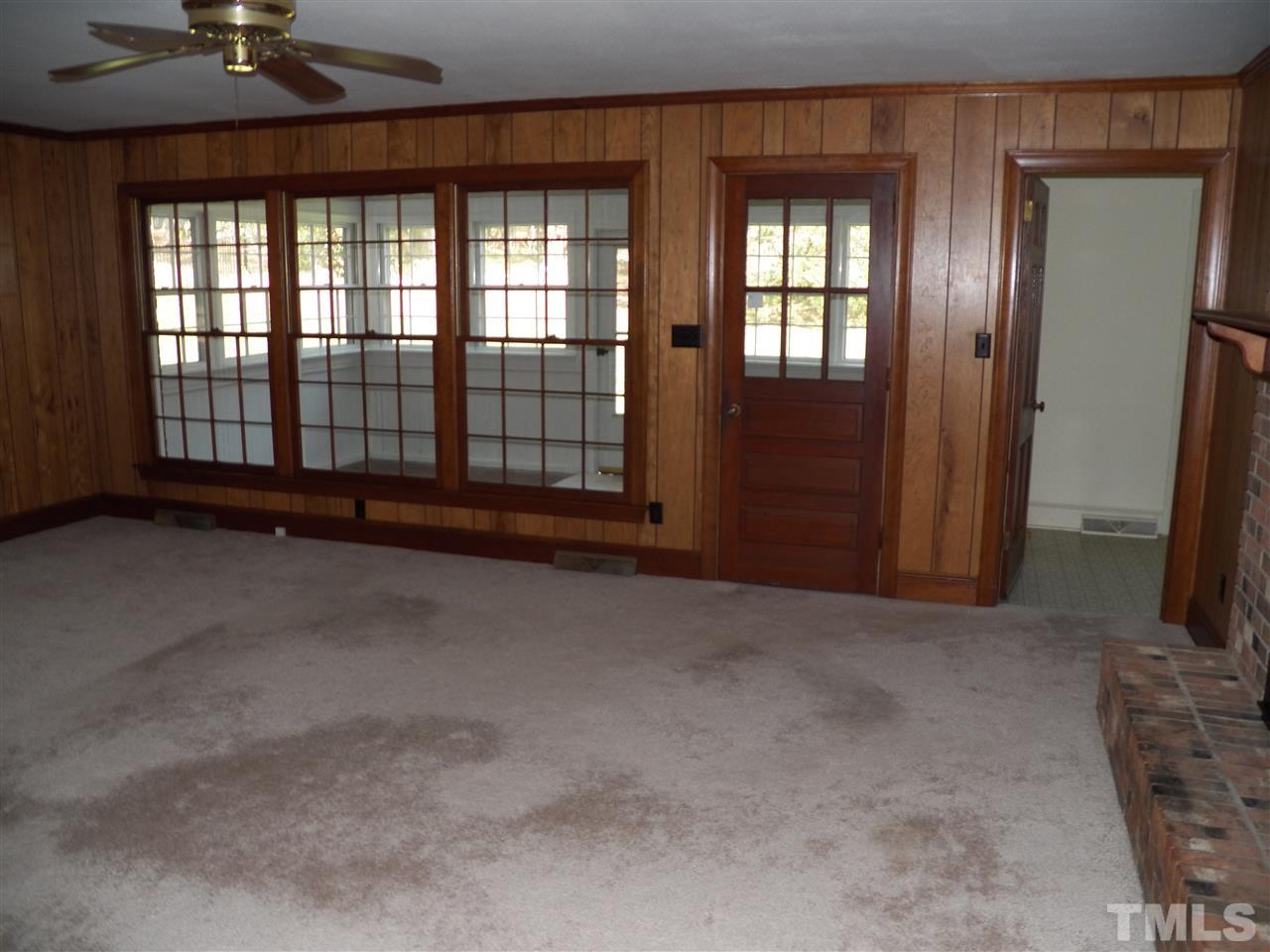 4704 Stiller Street Raleigh, NC 27609 - Photo 12 of 25 an empty room with windows