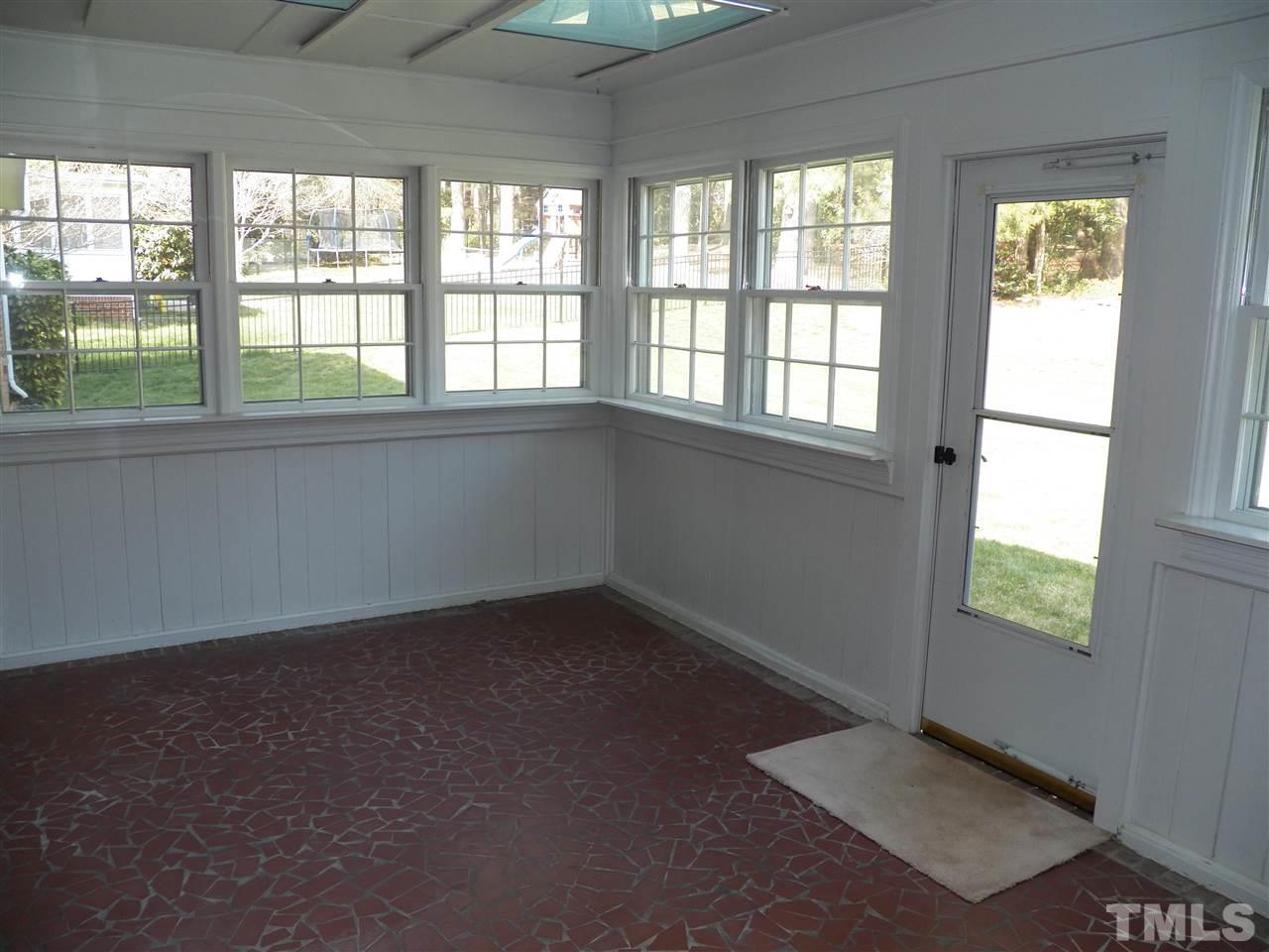4704 Stiller Street Raleigh, NC 27609 - Photo 15 of 25 an empty room with a window