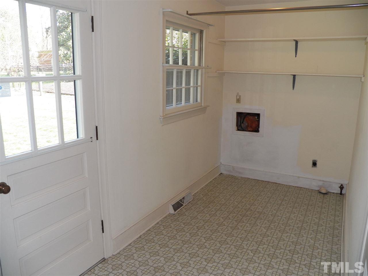 4704 Stiller Street Raleigh, NC 27609 - Photo 23 of 25 a view of an empty room with a window