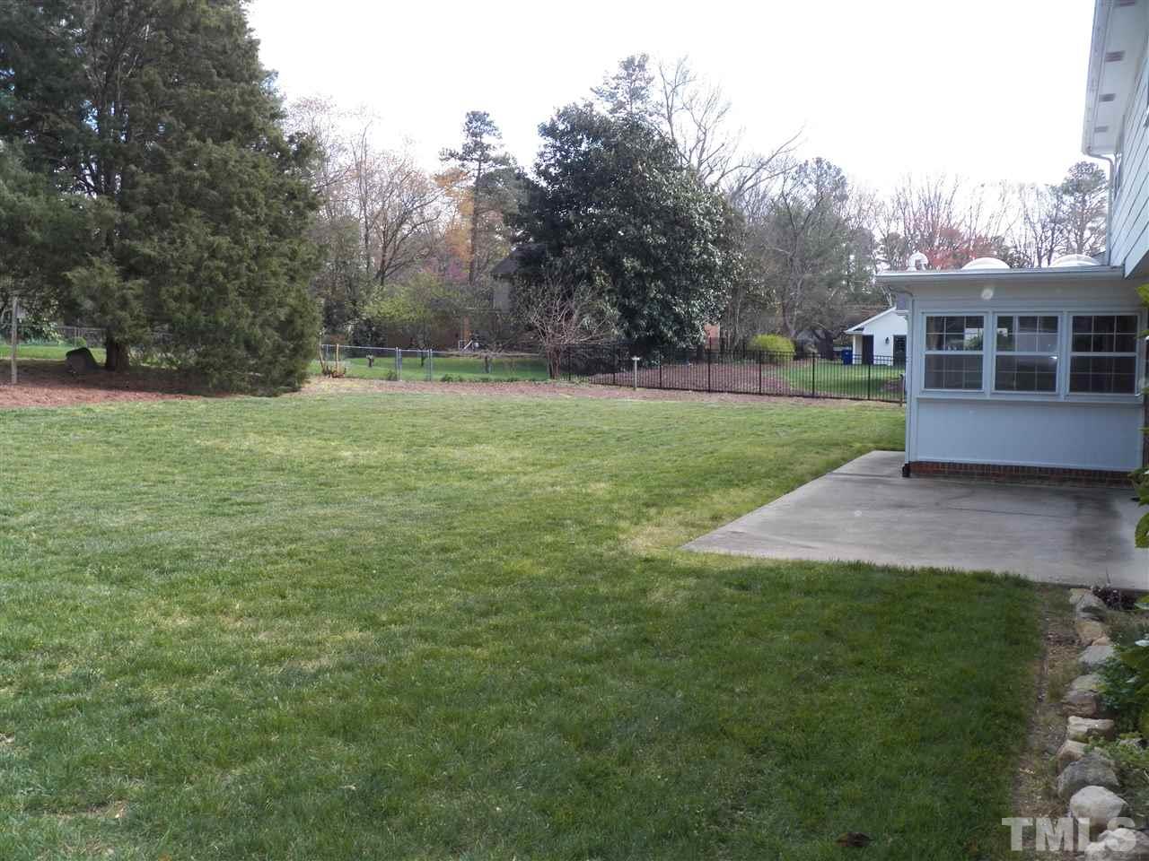 4704 Stiller Street Raleigh, NC 27609 - Photo 24 of 25 a view of a house with a yard
