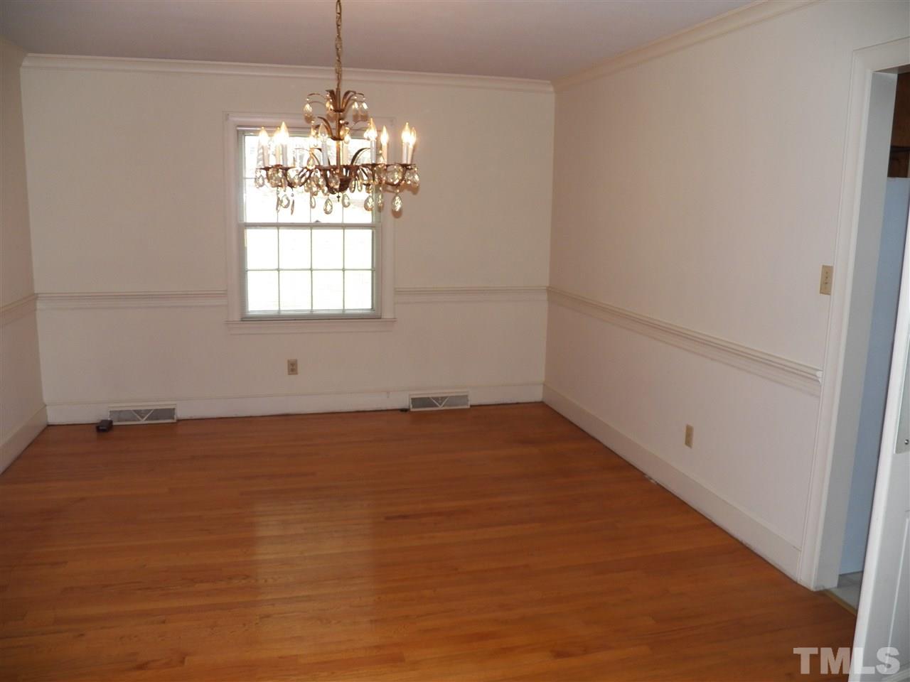 4704 Stiller Street Raleigh, NC 27609 - Photo 5 of 25 a view of a room with window and wooden floor