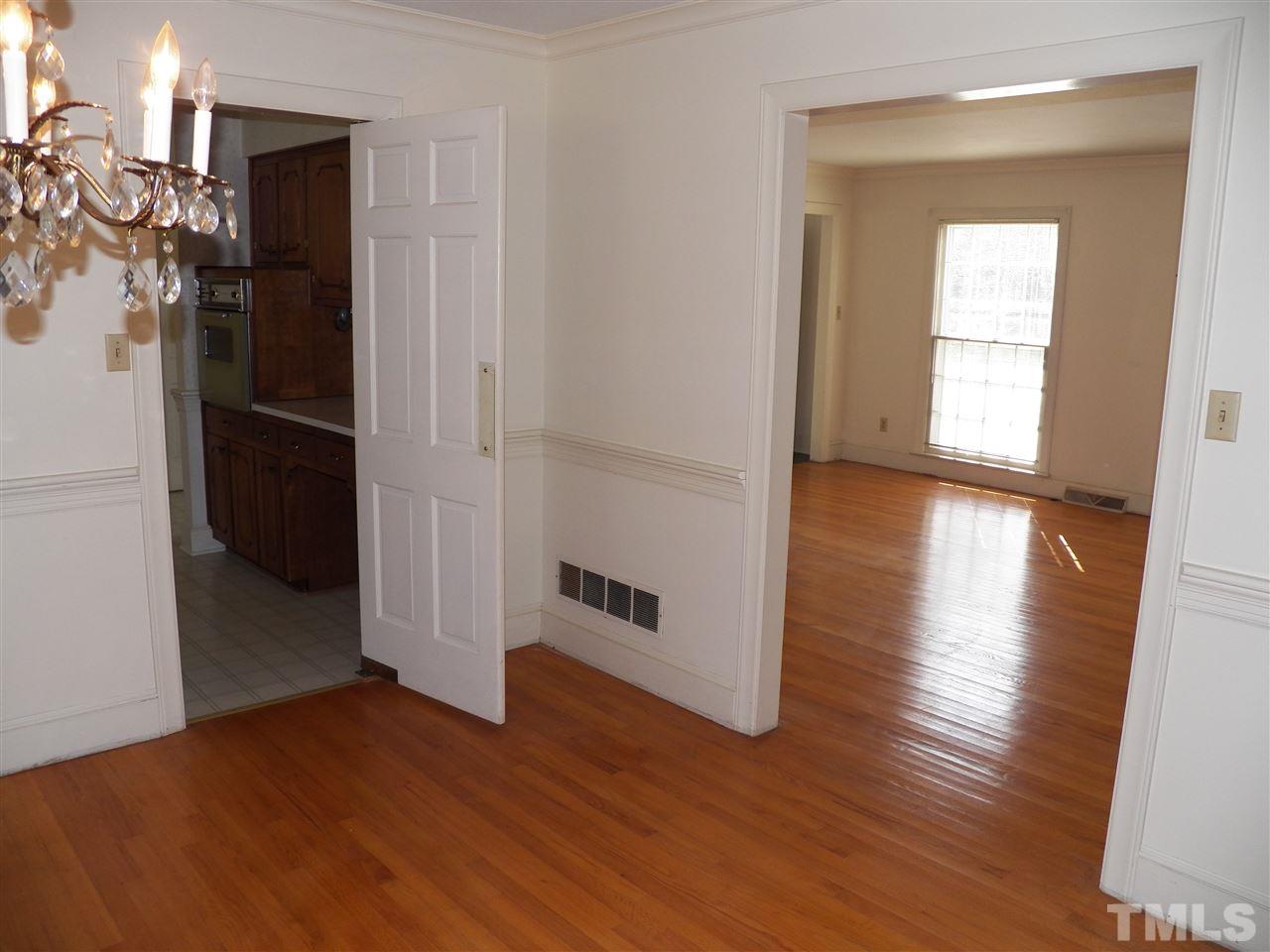 4704 Stiller Street Raleigh, NC 27609 - Photo 6 of 25 a view of hallway with wooden floor