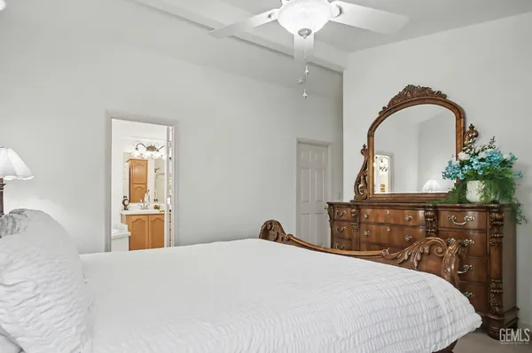 a bedroom with a bed and a dresser
