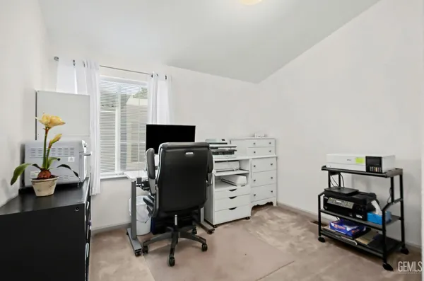 a view of a workspace with furniture