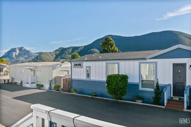 a view of a house with a yard and garage