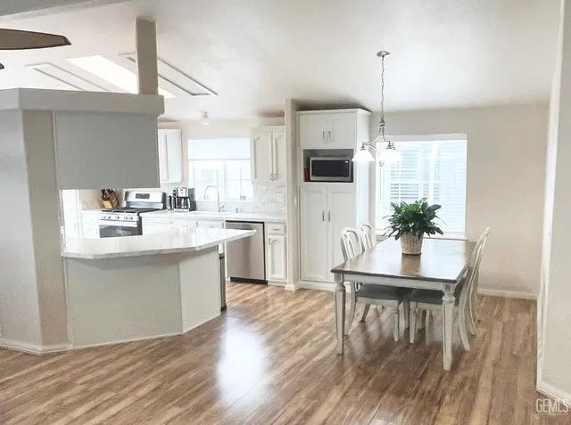 a view of a dining room with furniture