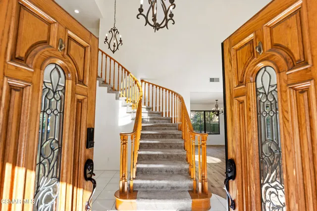 a view of an entryway with wooden floor