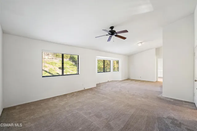 a view of an empty room with a window