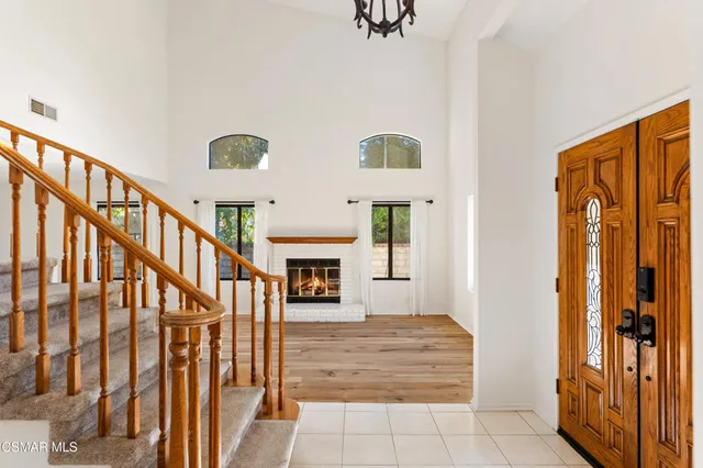 a view of an entryway with wooden floor