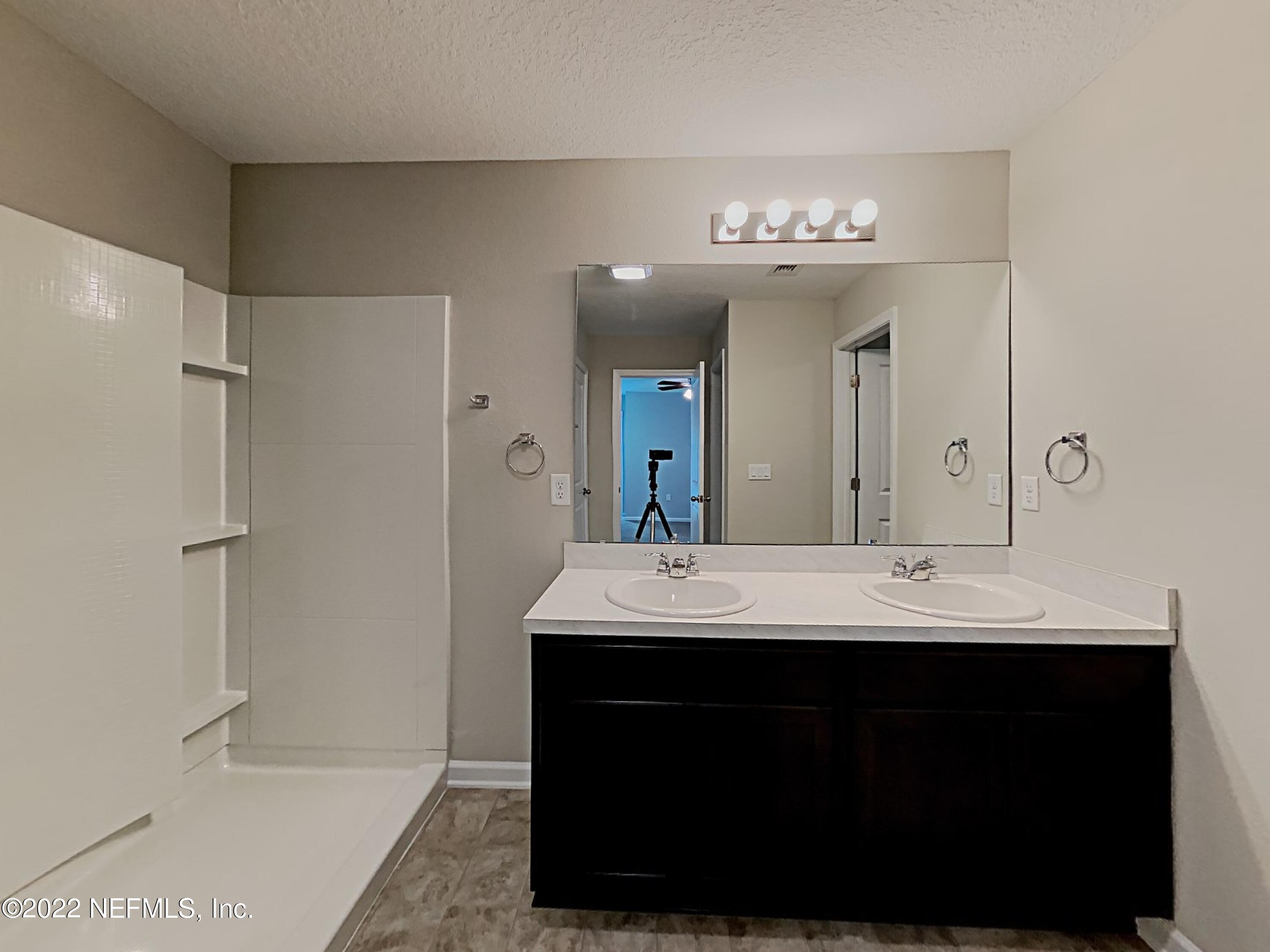 1562 Liberty Tree Place Jacksonville, FL 32221 - Photo 11 of 19 a bathroom with a sink double vanity and a mirror